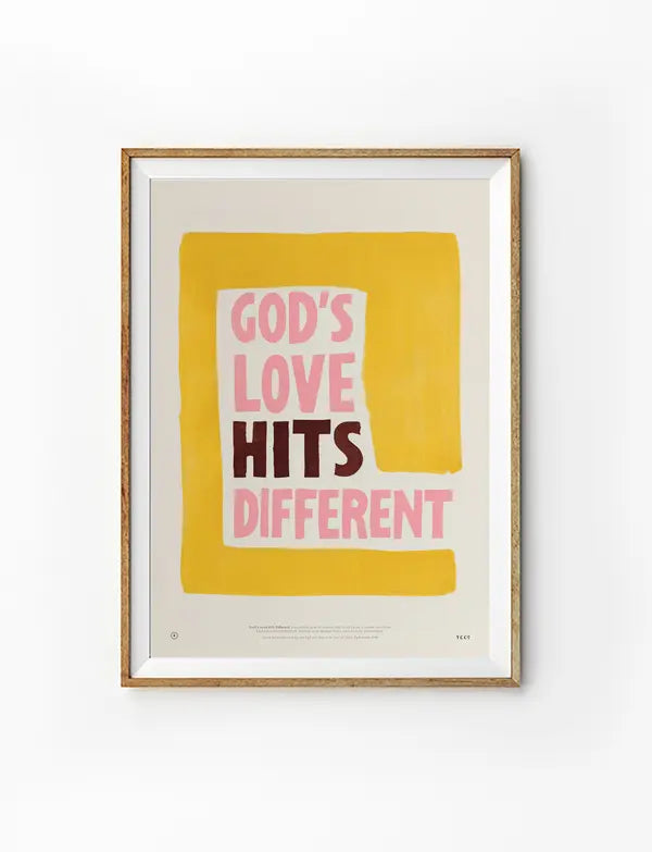 God’s Love Hits Different Christian poster in a light wood frame