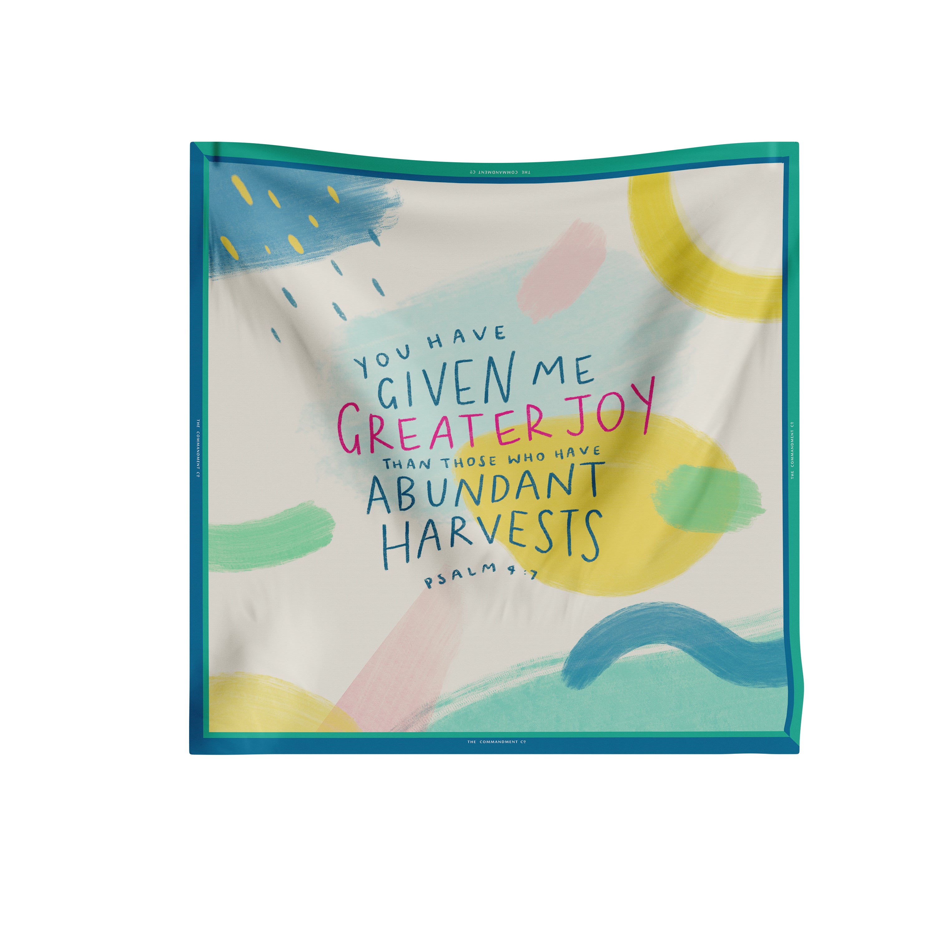 Greater Joy Psalm 4:7 scarf featuring an abstract pastel print with teal border; square scarf design from The Commandment Co