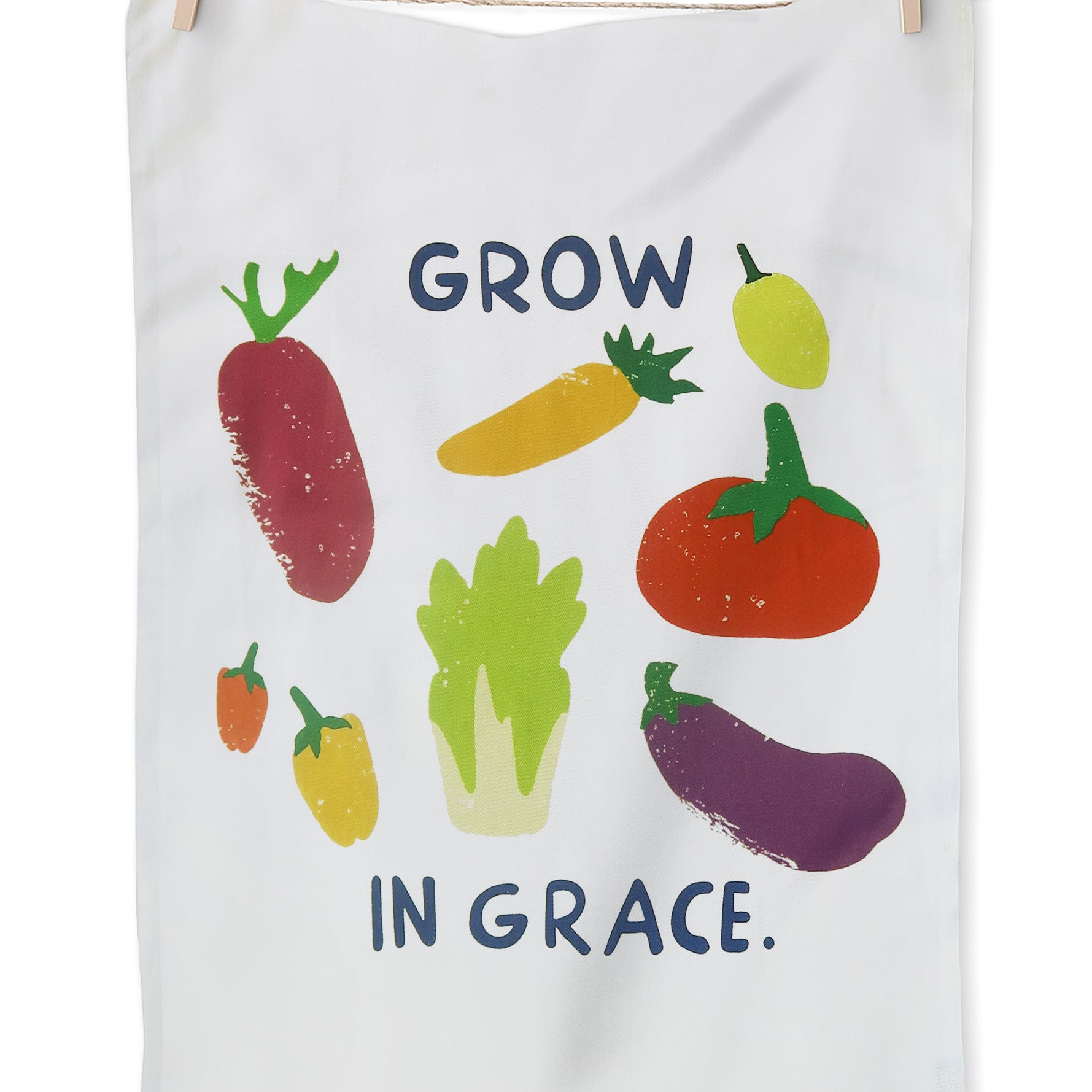 Grow in Grace tea towel featuring colorful vegetable illustrations on white fabric with the phrase “Grow in Grace” — a contemporary Christian home decor gift.
