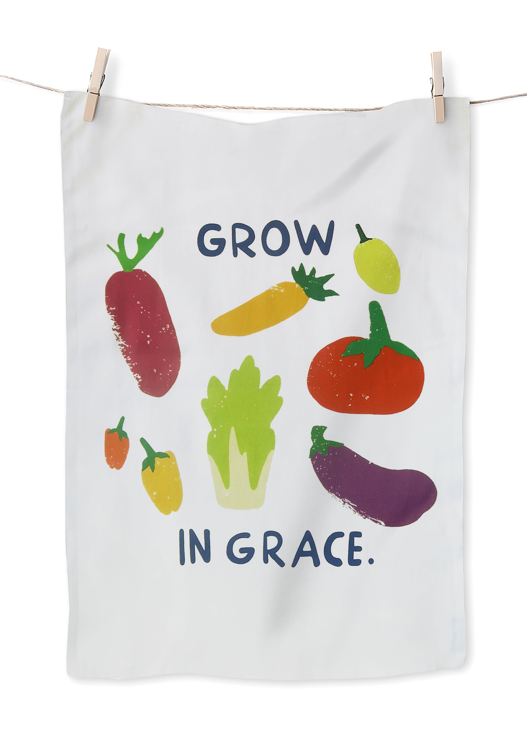 Grow in Grace tea towel featuring colorful vegetable illustrations on white fabric with the phrase “Grow in Grace” — a contemporary Christian home decor gift.