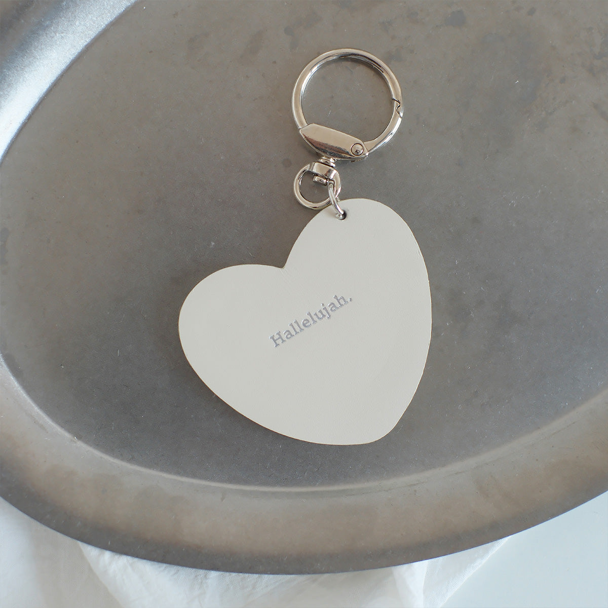 Heart-shaped keychain engraved with 'Hallelujah,' a faith-inspired minimalist accessory ideal for gifting and everyday use.