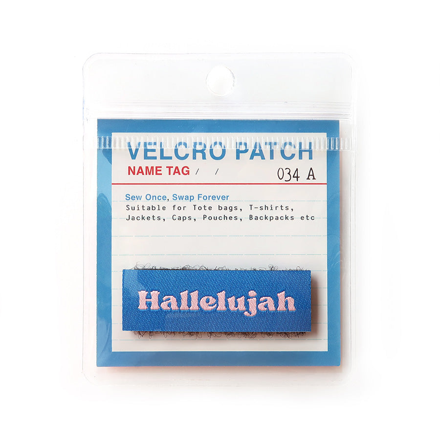Velcro tag with the word 'Hallelujah' in pink text on a blue background, a Christian praise accessory for bags and clothing.