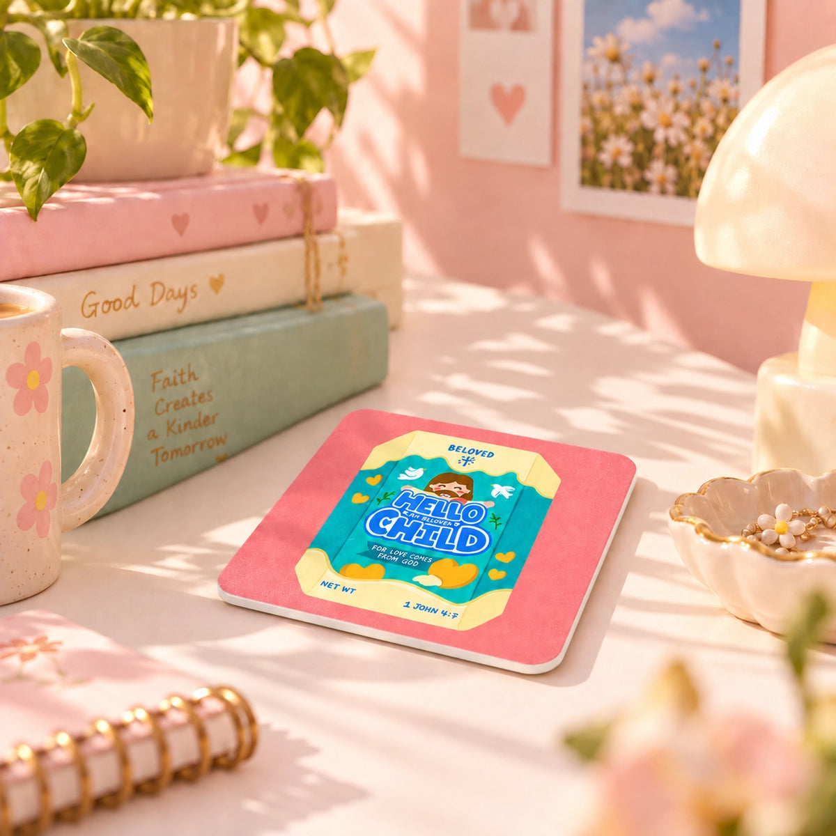 Hello Child Chocolate Biscuit Christian coaster styled on a cheerful pink desk