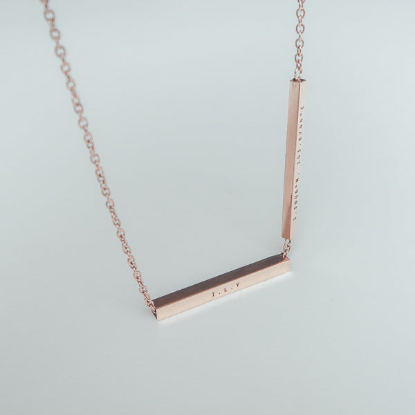 Hidden Message bar pendant necklace shown as a personalised gift.