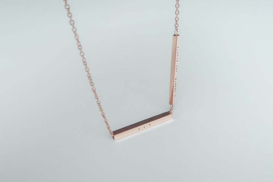 Hidden Message bar pendant necklace shown as a personalised gift.