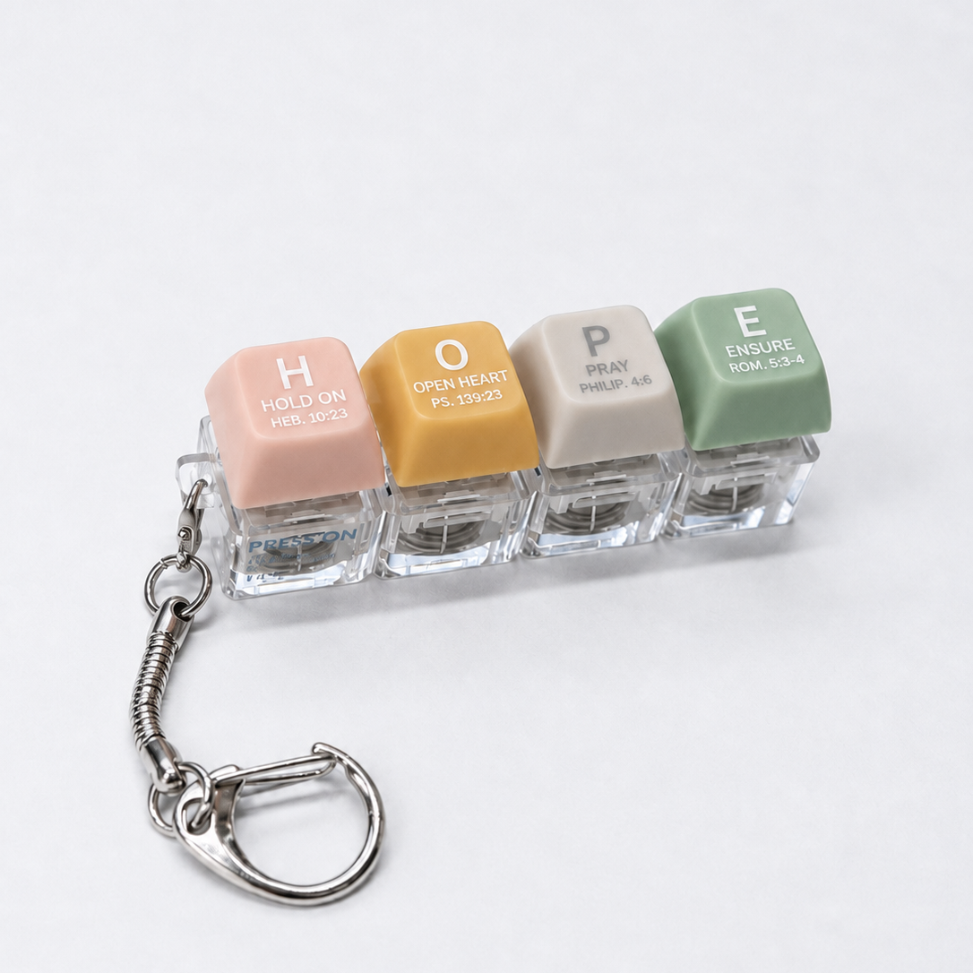 HOPE press-on light-up keycap keychain with pastel coloured keys spelling hope, featuring Scripture-inspired words on a bright white studio background.