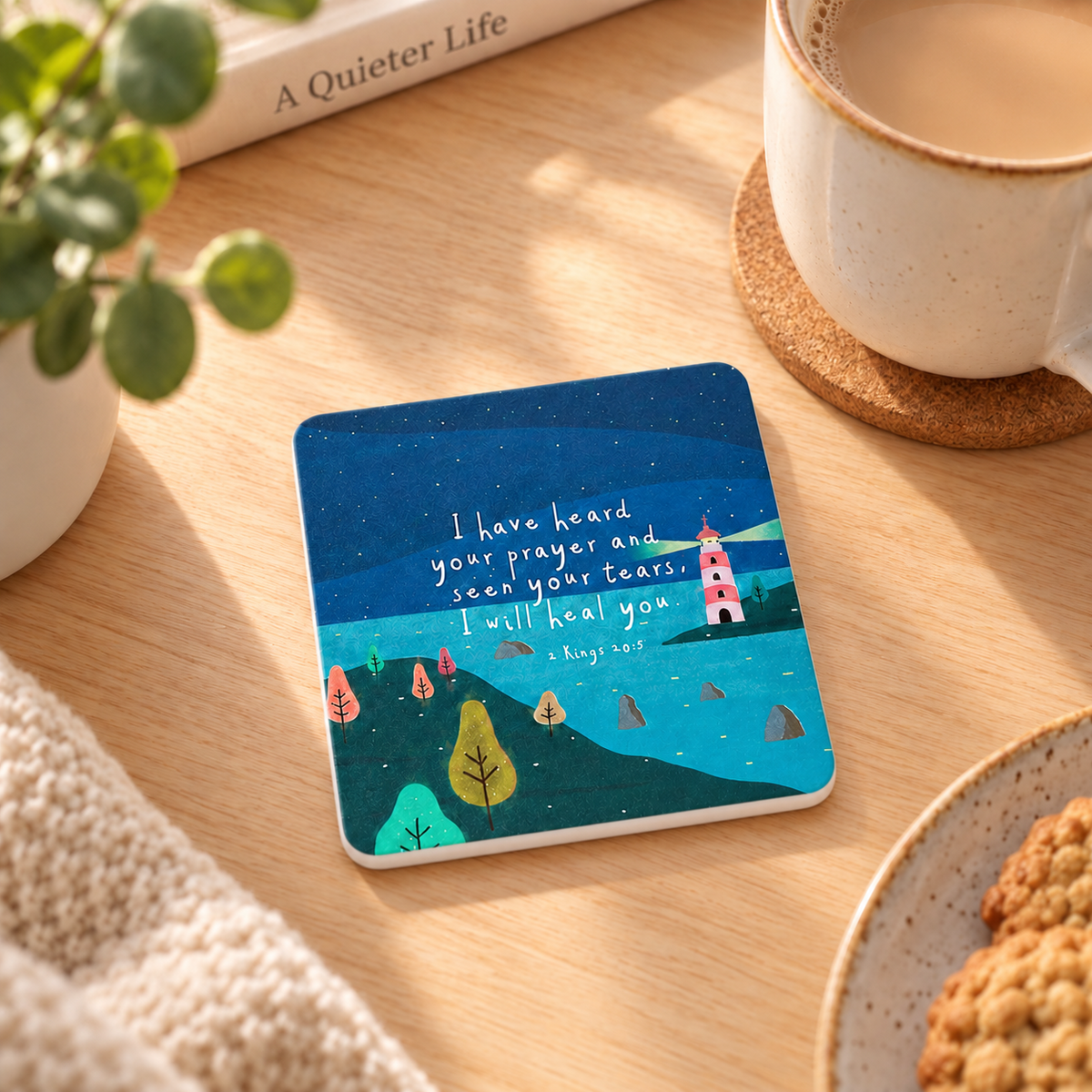 I Have Heard Your Prayer Christian coaster with lighthouse artwork styled beside coffee in a warm home setting.