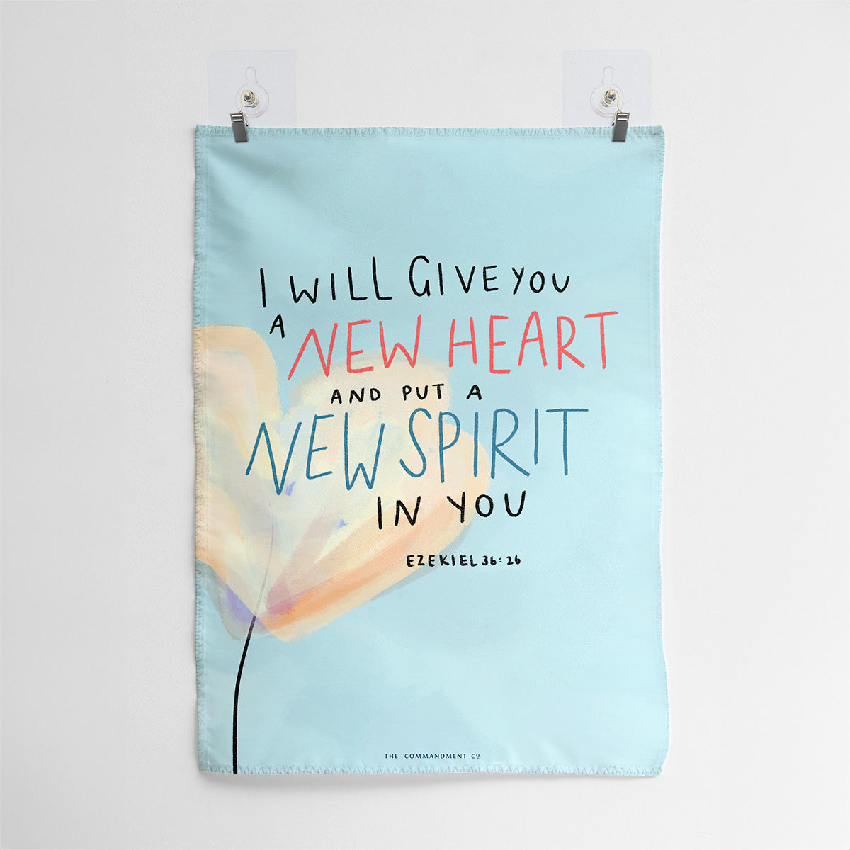Christian wall art featuring the Bible verse 'I Will Give You a New Heart and Put a New Spirit in You' from Ezekiel 36:26, with a soft pastel background and abstract floral illustration