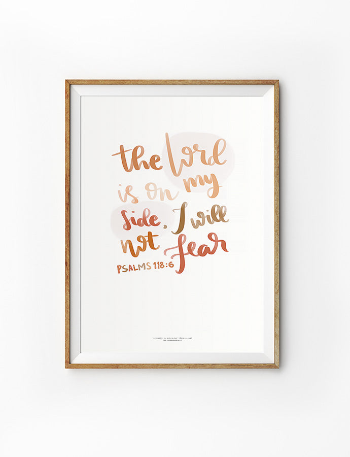 A framed artwork with the scripture "The Lord is on my side, I will not fear" from Psalms 118:6, designed in warm gradient tones with a handwritten-style font on a minimalist white background.
