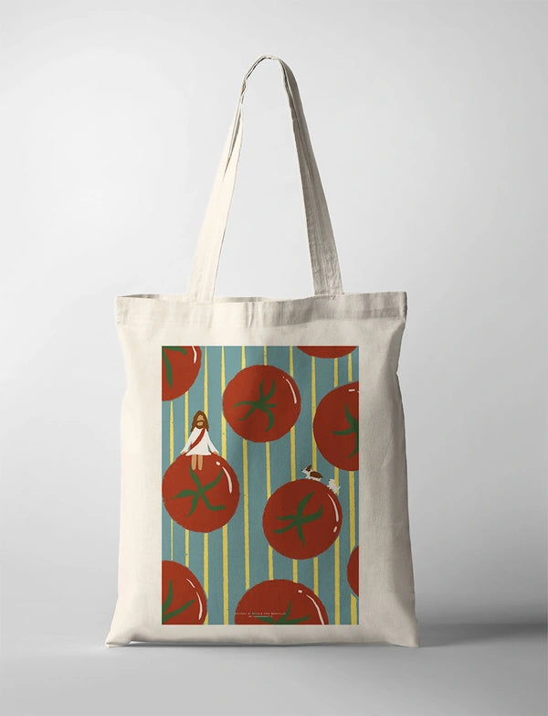 Jesus and Tomatoes CollabPlus+ tote bag with a colourful illustration of Jesus sitting among oversized tomatoes, designed by @nartellac