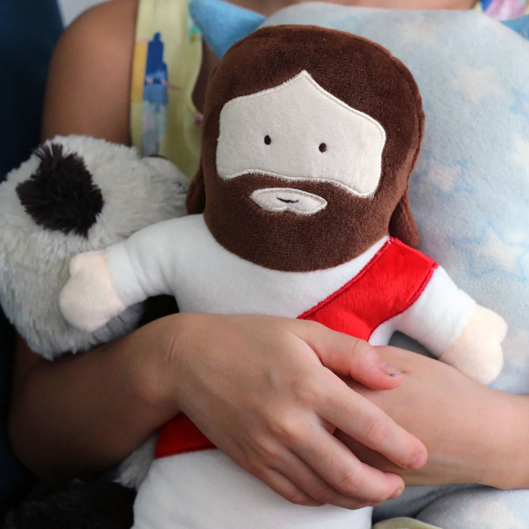 Soft Jesus plush toy for kids with red sash and friendly smile