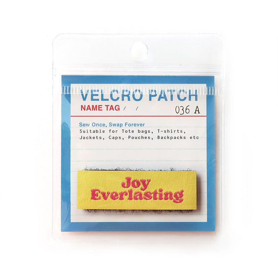 Velcro tag featuring the phrase 'Joy Everlasting' in pink text on a yellow background, designed as a Christian inspirational patch for clothing and accessories.