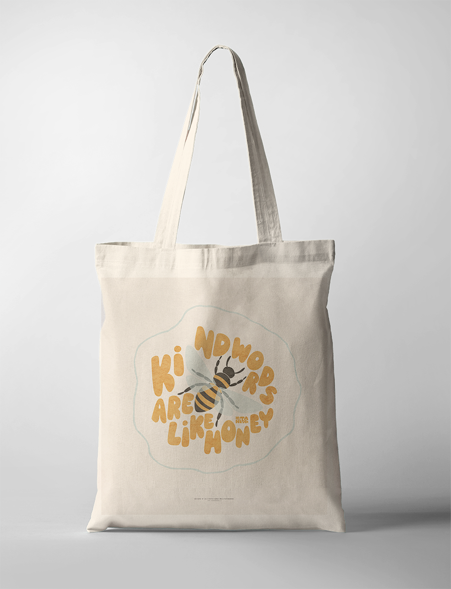 "Kind words are like honey" tote bag by Anita Kick featuring a cheerful bee illustration, inspiring kindness and simple happiness in any space.