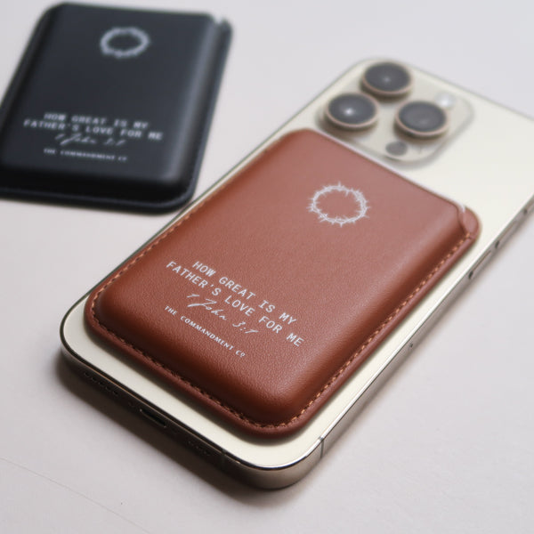 Lifestyle shot of brown Leather MagSafe Wallet attached to a smartphone, showcasing slim premium leather in everyday use