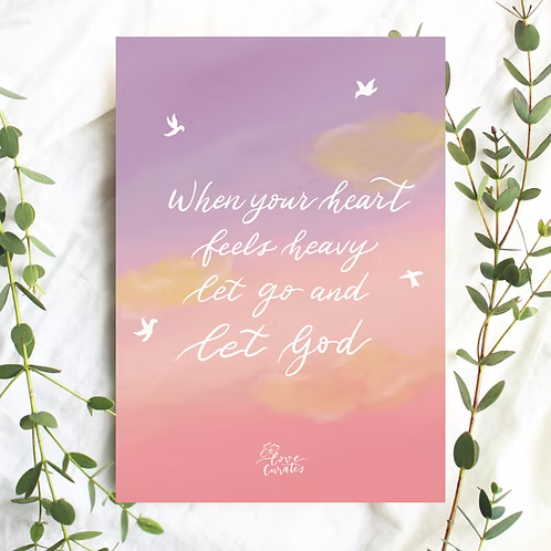 A6 Christian postcard featuring the message “When your heart feels heavy, let go and let God” on a soft pink and lavender sky with white birds.