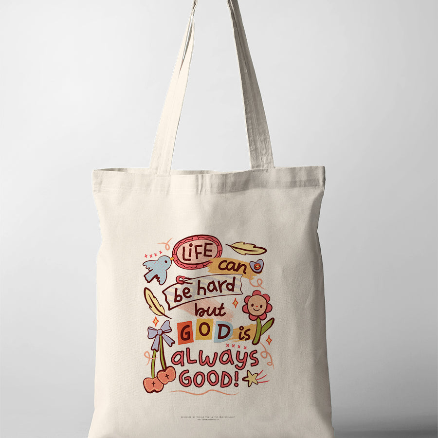 Christian tote bag featuring “Life can be hard but God is always good” with colourful illustrated details