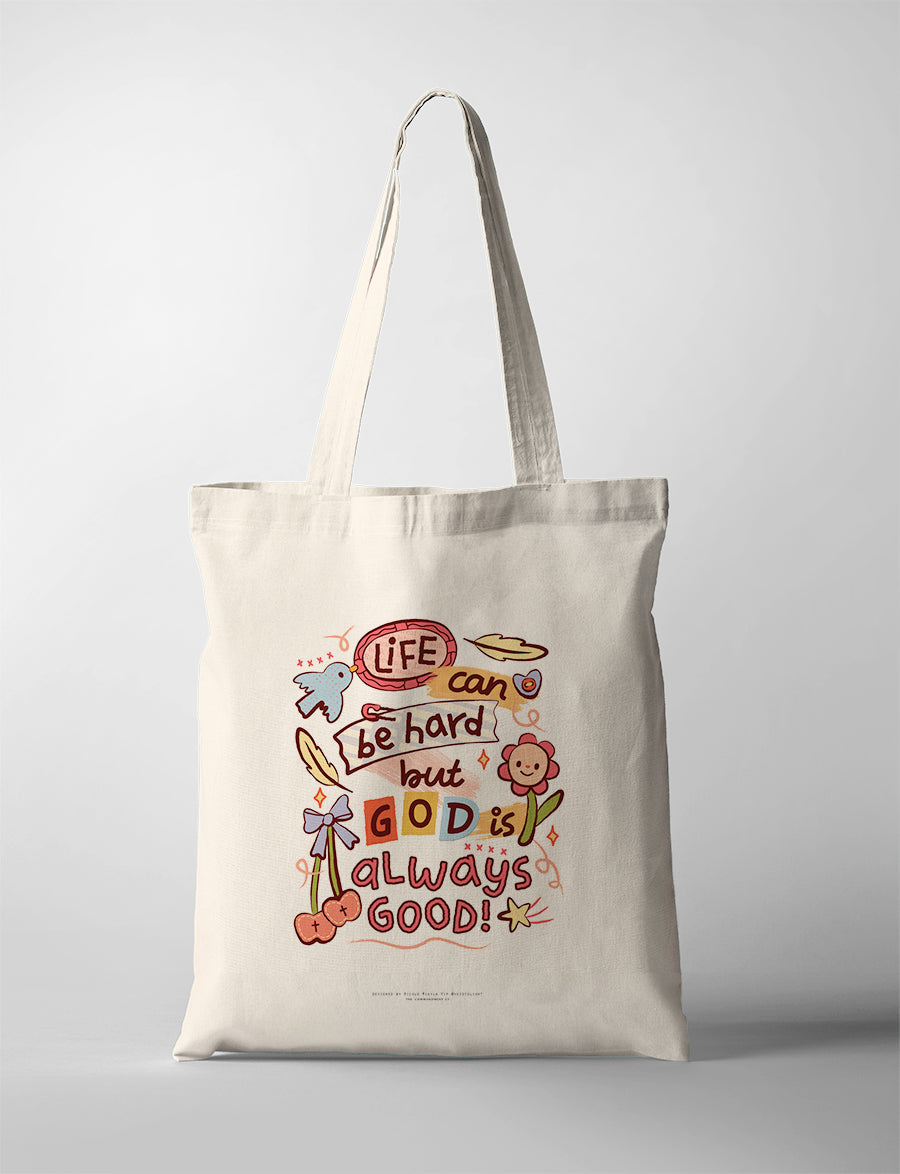 Christian tote bag featuring “Life can be hard but God is always good” with colourful illustrated details
