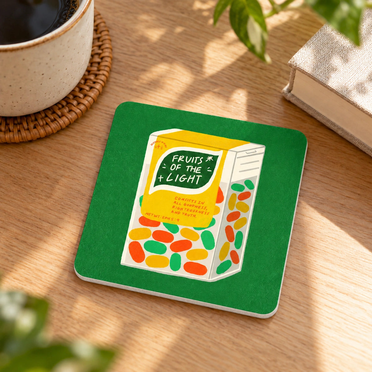 Light Fruity Mints LOVE SUPERMARKET Christian coaster styled on a sunlit wooden table.
