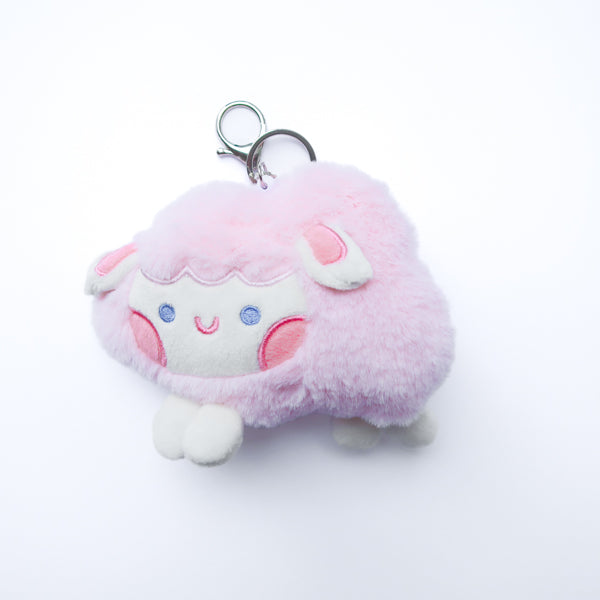 Three faith-inspired Lil Sheepies plush keychains in White Cumulus, Pink Hana, and Stormy Gray are displayed on a white background. Each soft, fluffy sheep represents a reminder of the Good Shepherd’s love, featuring a Bible verse charm, a retractable string for easy card access, and a secure keychain clip. Perfect as a Christian gift or daily faith companion.
