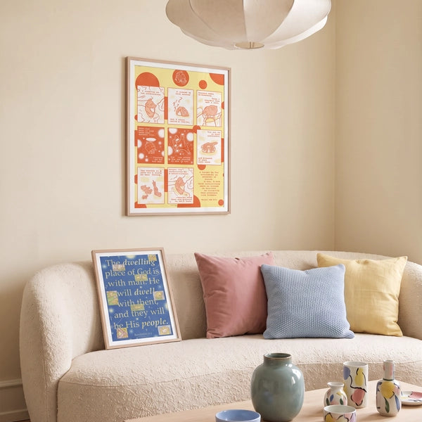 Love Has Brought Me Back Home yellow and orange Psalm 68:5–6 Christian poster displayed above a cream sofa in a warm living room, with a blue Dwelling Place of God poster leaning on the sofa
