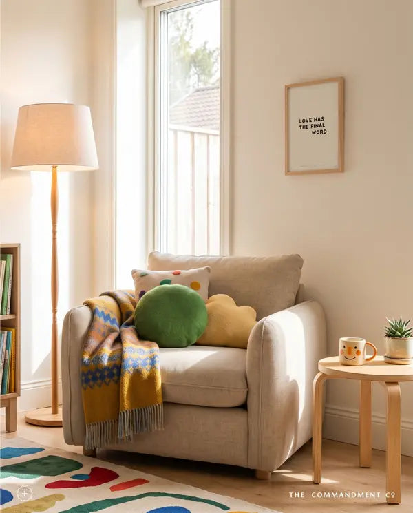 Love Has the Final Word Christian poster displayed above a cosy armchair in a bright reading corner