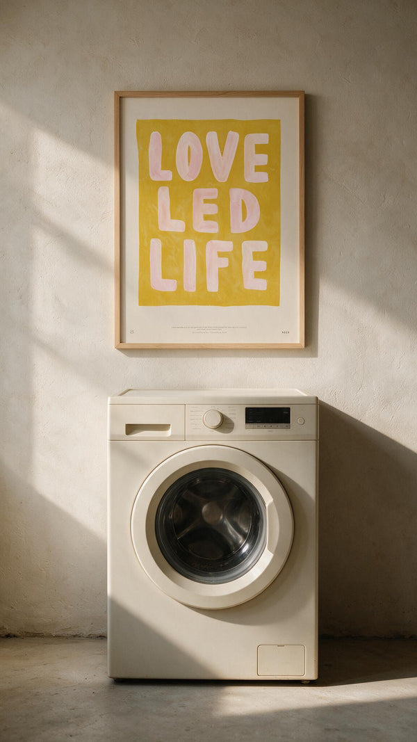 Love Led Life Christian wall art above a washing machine in warm natural light