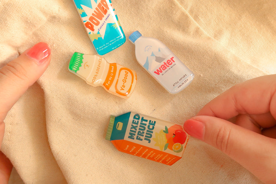 LOVE SUPERMARKET Christian acrylic pin lifestyle image featuring playful hand-drawn designs.