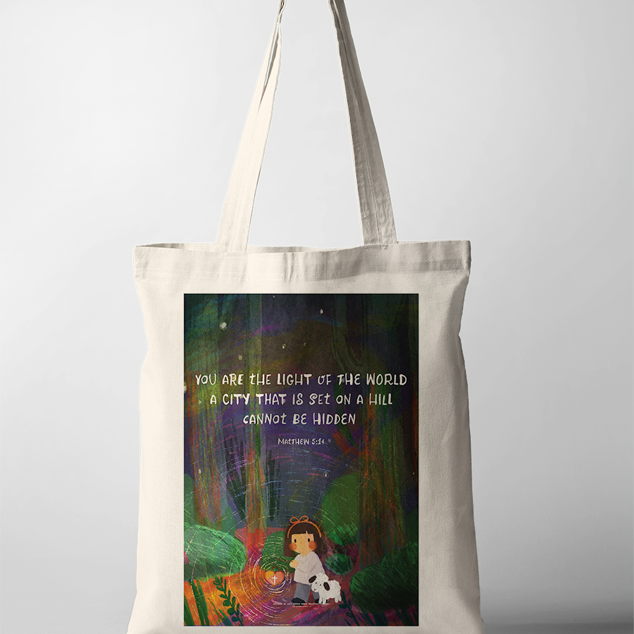 Christian tote bag with Matthew 5:14 “You are the light of the world,” girl holding lantern with lamb illustration, faith-based everyday carry bag.