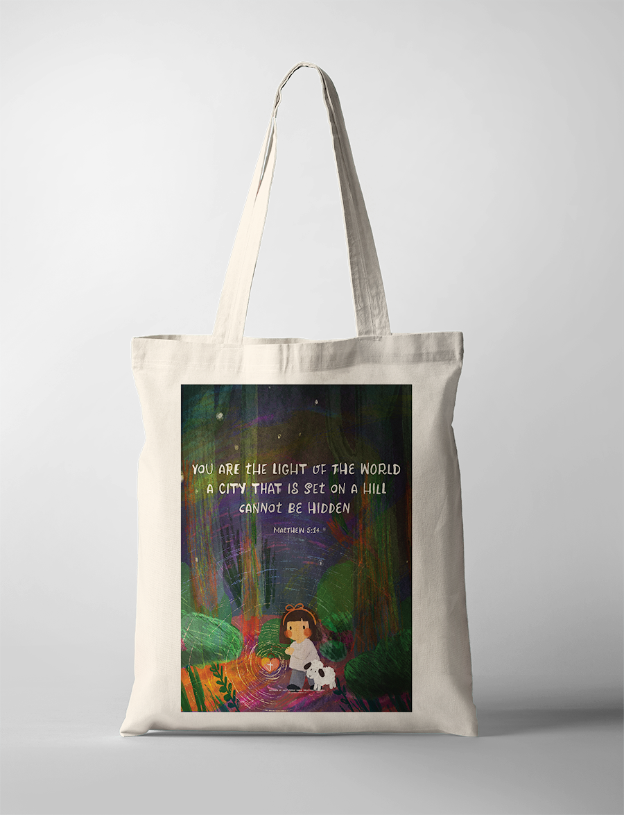 Christian tote bag with Matthew 5:14 “You are the light of the world,” girl holding lantern with lamb illustration, faith-based everyday carry bag.