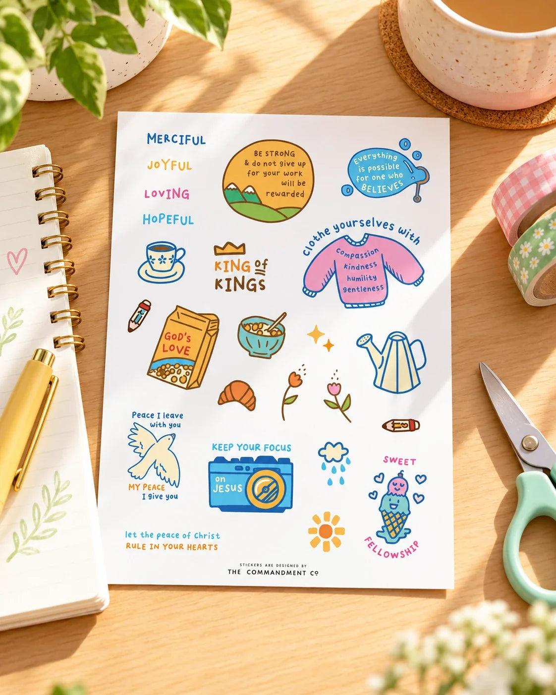 Mercies journaling sticker sheet styled on warm wooden desk