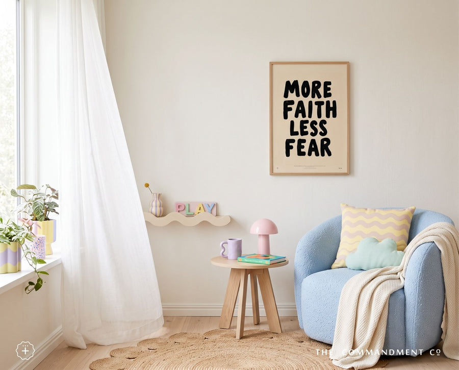 More Faith Less Fear Christian poster displayed above a blue chair in a colourful reading room
