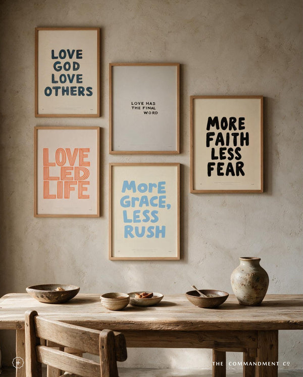 More Faith Less Fear Christian poster arranged in a warm neutral gallery wall above a wooden table