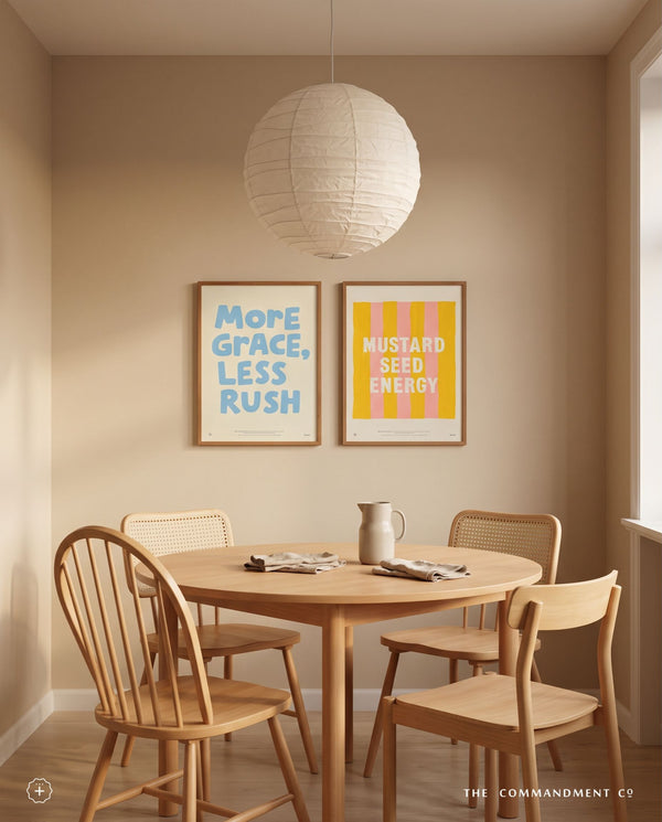 More Grace Less Rush Christian poster displayed with Mustard Seed Energy artwork in a warm neutral dining room