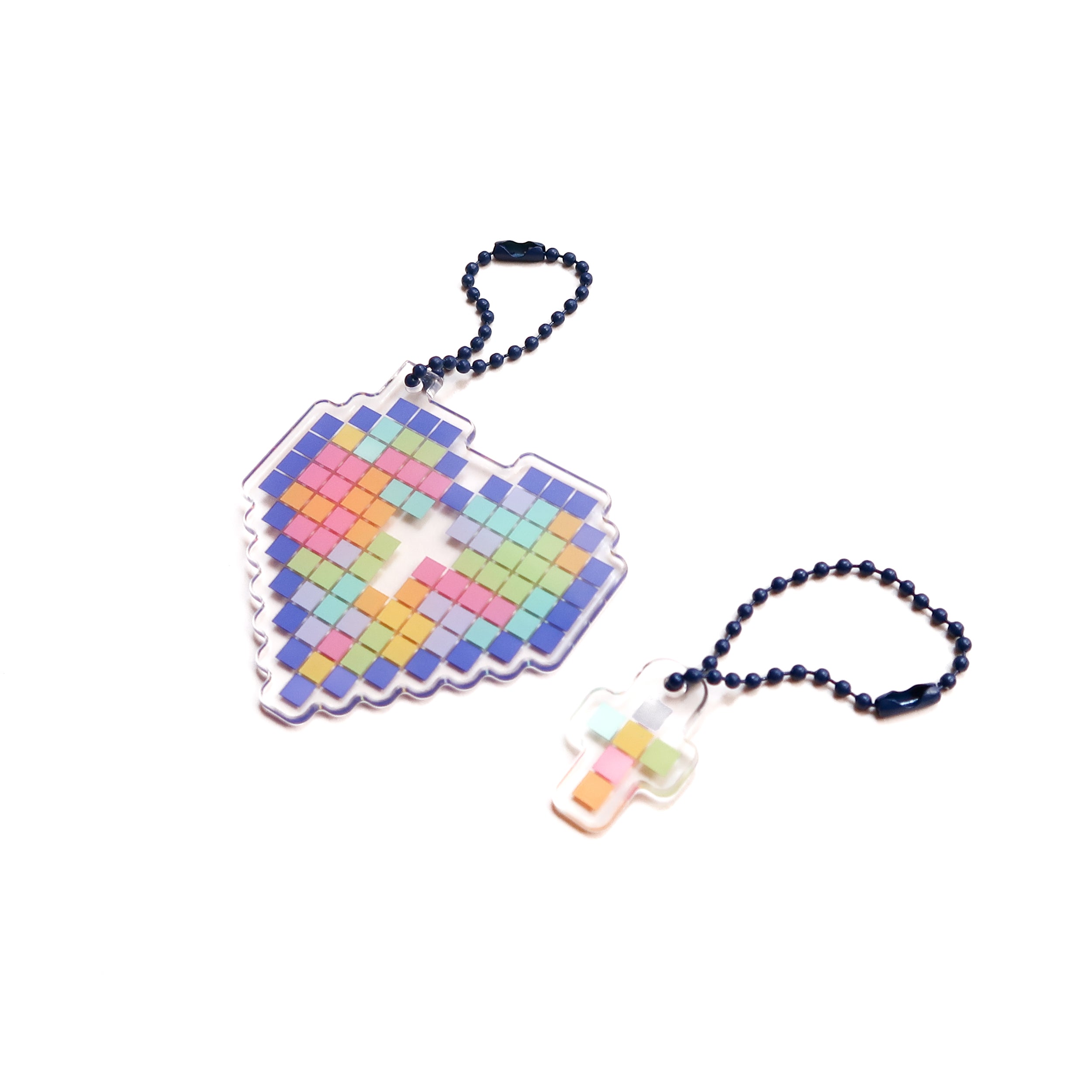 Acrylic keychains with a mosaic heart and cross design, from The Commandment Co, Singapore.