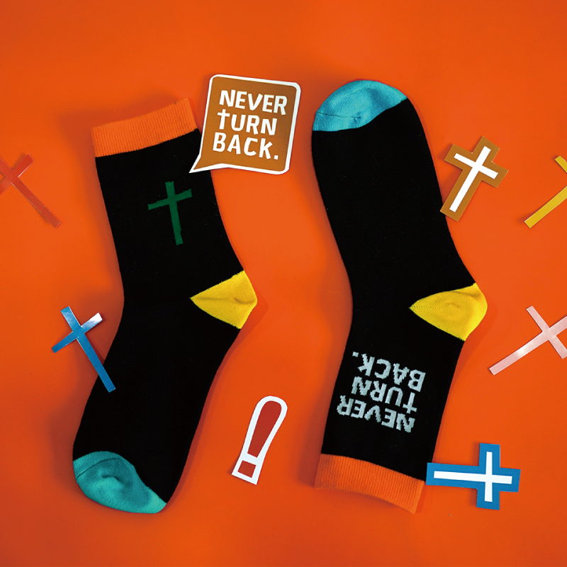 Christian inspirational socks with “Never Turn Back” message and cross design, faith-based gift by The Commandment Co