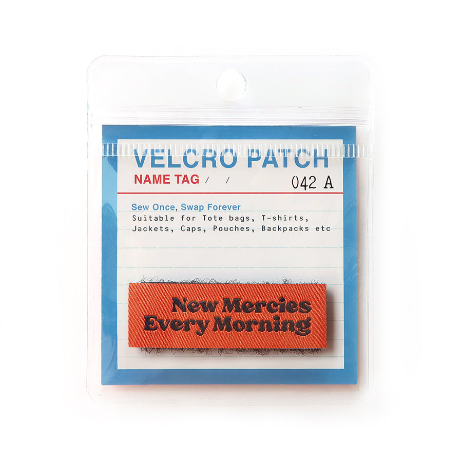 Red Velcro tag with black text 'New Mercies Every Morning,' a faith-based embroidered patch for accessories and clothing