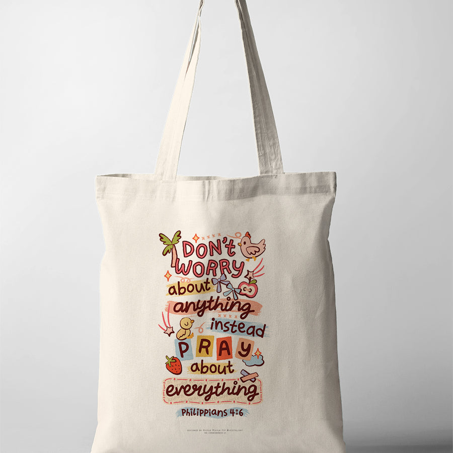 Christian tote bag featuring Philippians 4:6 reminder to pray about everything with colourful illustrated design