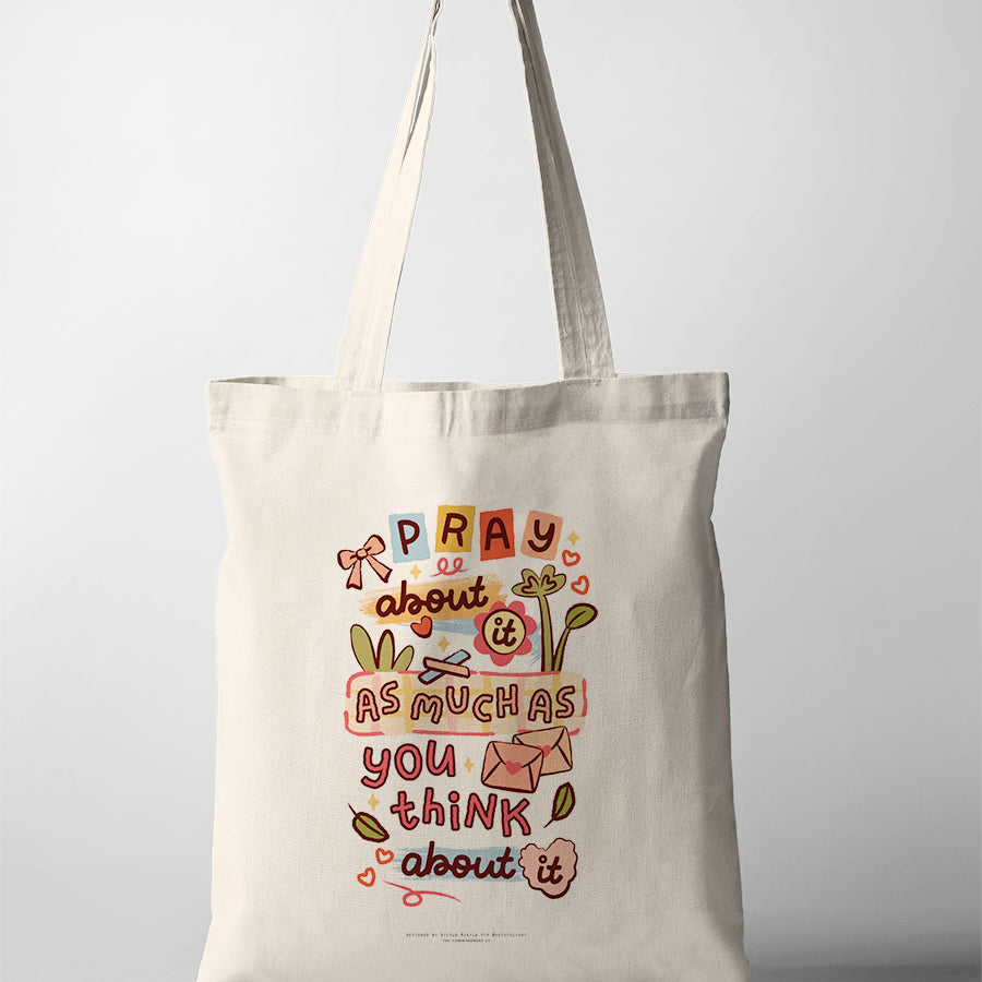 Christian tote bag featuring “Pray about it as much as you think about it” with playful hand-lettered artwork