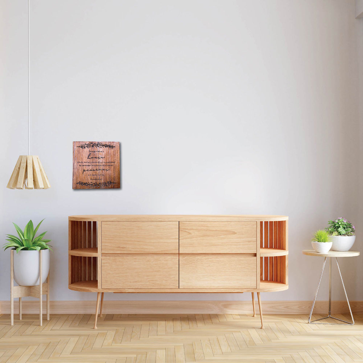 Wooden wall art featuring Proverbs 24:3-4: 'Through wisdom a house is built,' displayed on a minimalistic wooden cabinet against a light wall, perfect for Christian home decor and inspirational gifts.