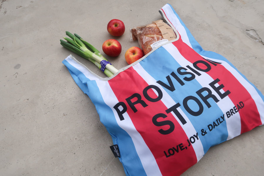 Close-up of Provision Store
foldable reusable shopping
bag with groceries,
featuring the message
"Love, Joy & Daily Bread,"
ideal for Christian gifts.