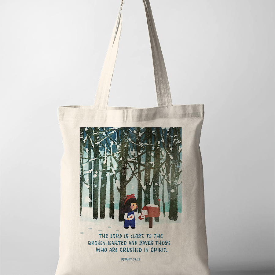 Christian tote bag with Psalm 34:18 “The Lord is close to the brokenhearted; He rescues those whose spirits are crushed,” winter forest illustration, comforting faith tote bag.