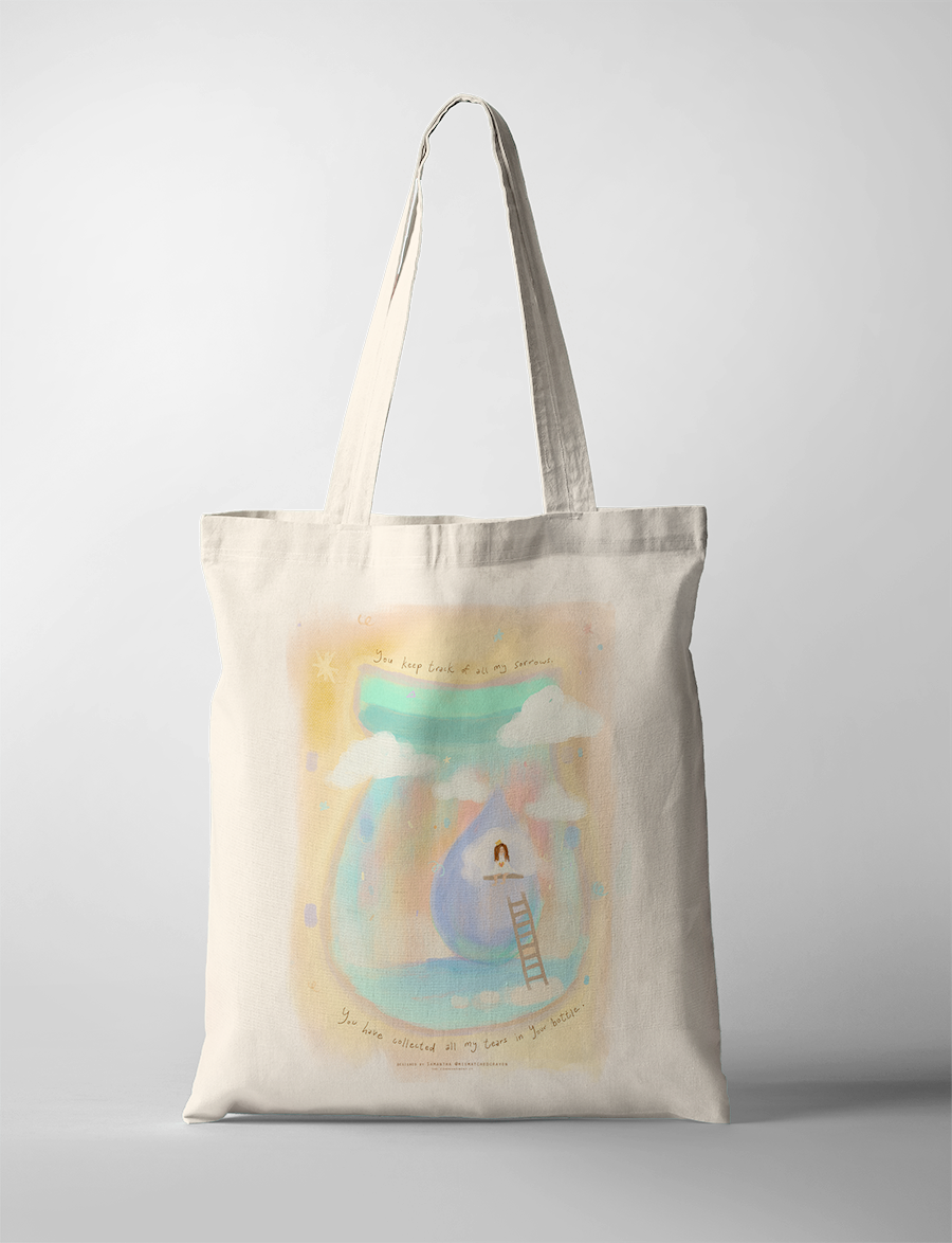 Faith-inspired tote bag featuring Psalm 56:8 “You have collected all my tears in your bottle,” soft pastel artwork of a girl sitting on a cloud above a large teardrop jar.
