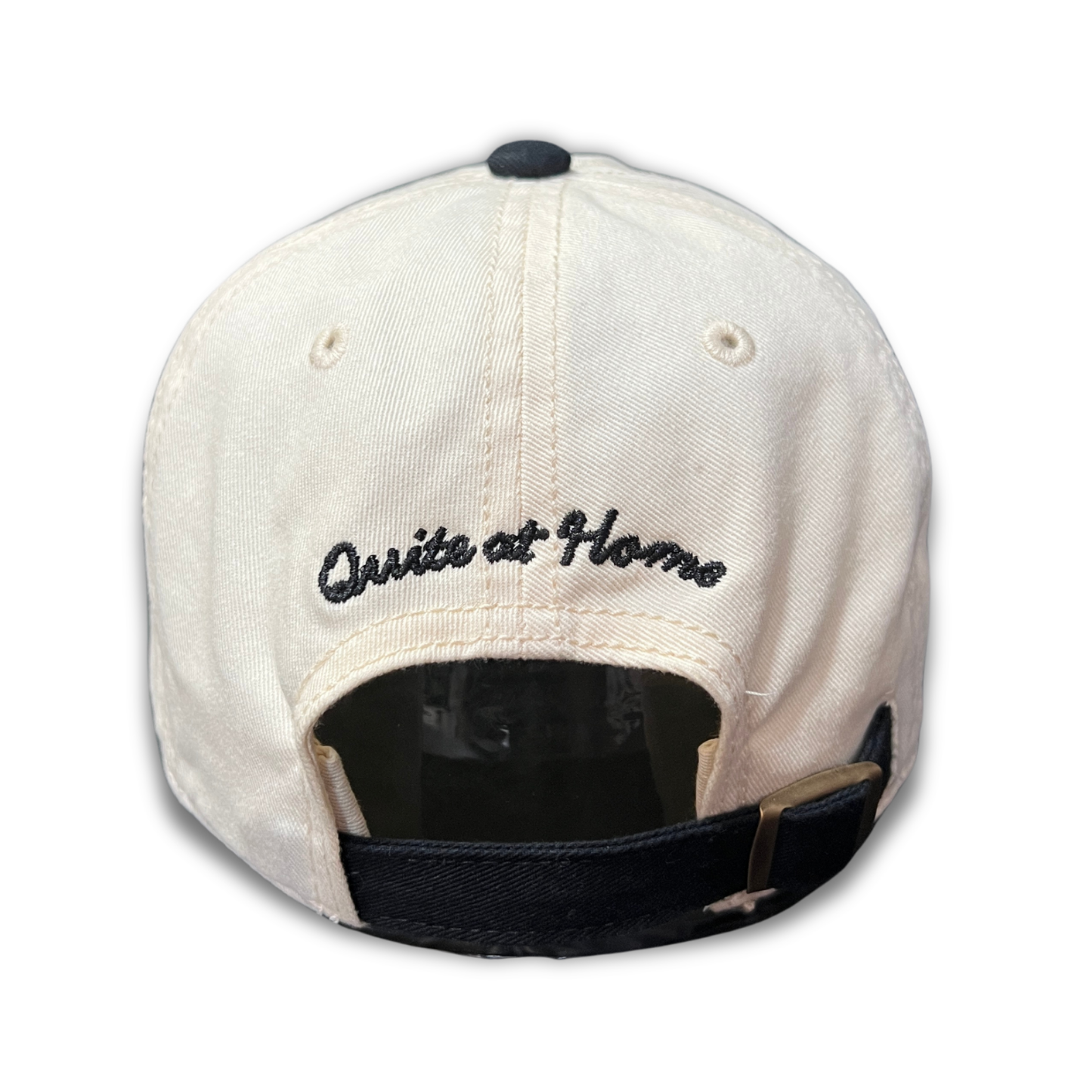 Back view of Love Unfairly cap with Quite at Home embroidery and adjustable strap