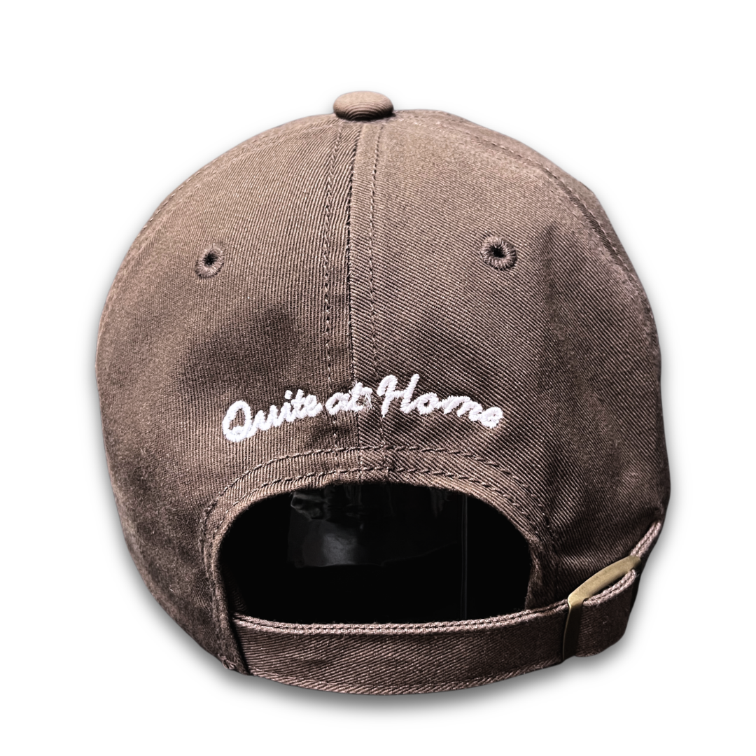 Back view of That's Crazy cap with Quite at Home embroidery and adjustable buckle.
