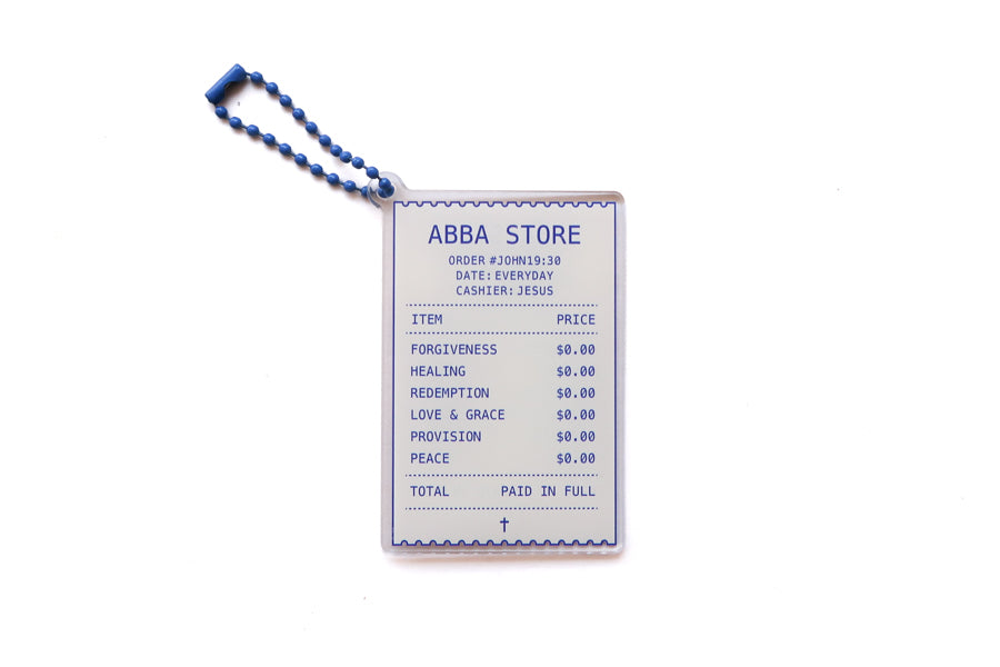 Front view of Abba Store receipt acrylic keychain featuring forgiveness, healing, redemption, love and grace, provision, peace, and Paid in Full details
