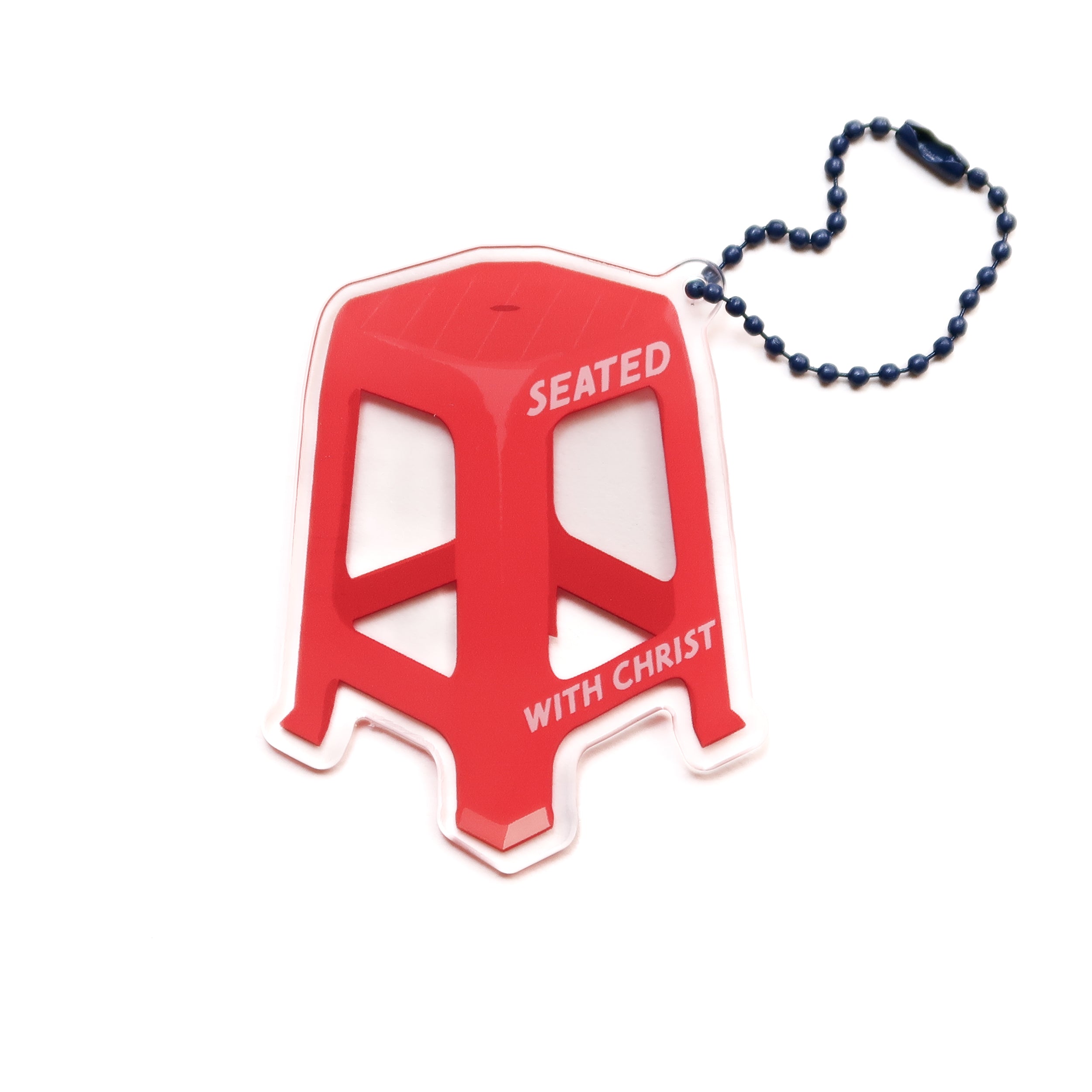Red chair acrylic keychain with "Seated with Christ" design, from The Commandment Co, Singapore.