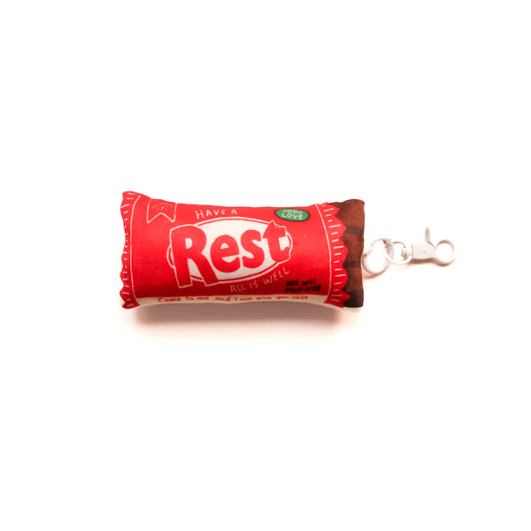 Rest Choco Bar plushie keychain with red chocolate bar-inspired design and clip.