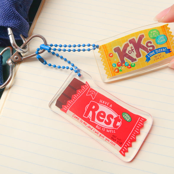 Christian-inspired Love Supermarket acrylic keychains shown together.