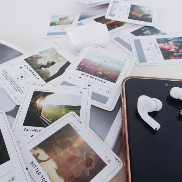 Christian scratch card with earbuds for listening to faith-based music