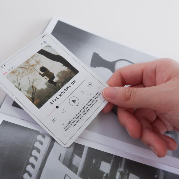 Bible verse scratch card used in a book for daily encouragement